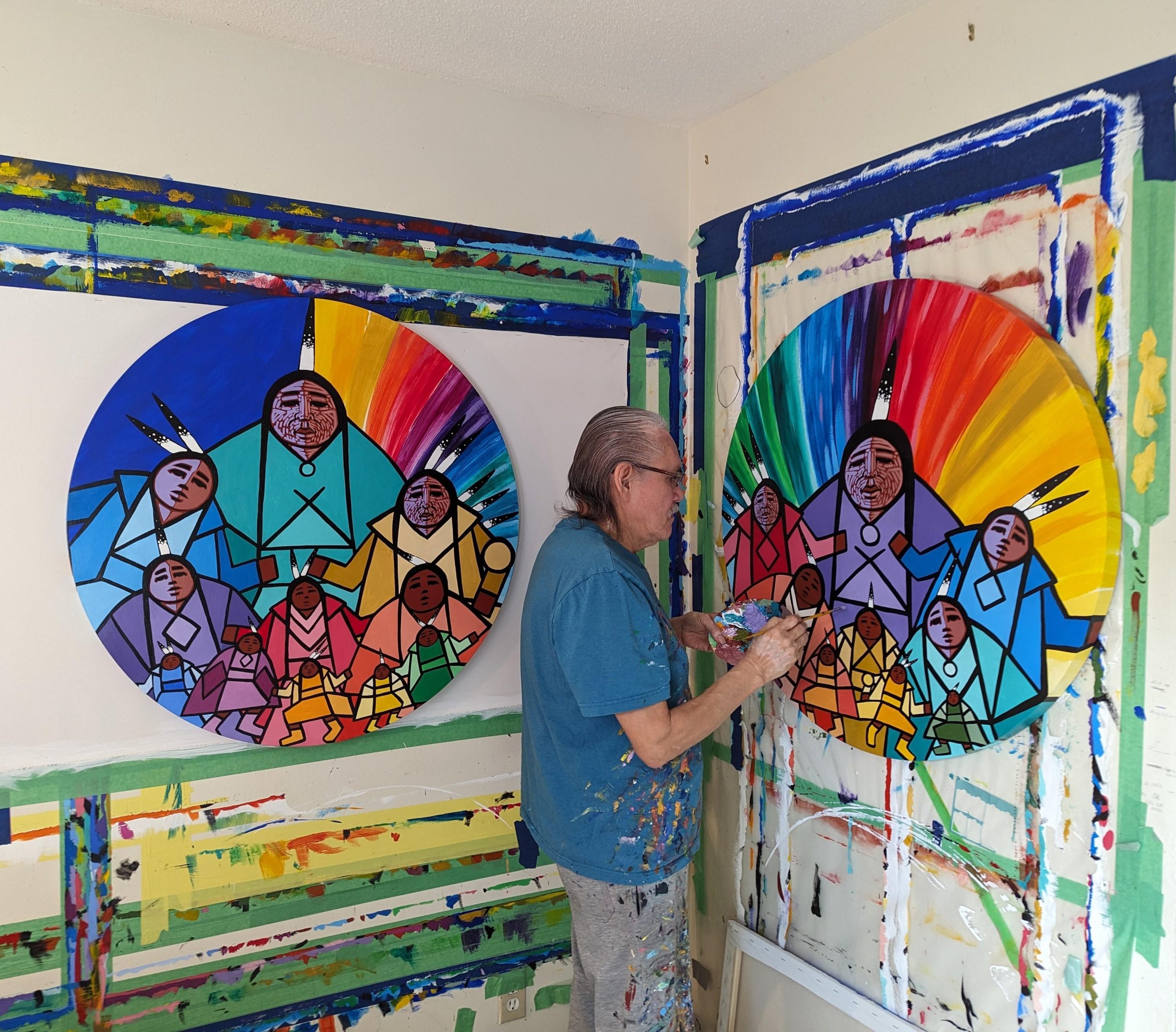 Artist Jerry Whitehead paints in his studio.